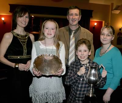 Reanna and Robert Craig with James and Doreen Chestnutt from Chestnutt Animal Feeds. The Craig&rsquo;s won the Interbreed Junior Champion at Balmoral; Champion at the NI Blue Heifer Derby; Runners-up in the Show Herds Competition and Reserve Champion in the Show Herd of the Year.